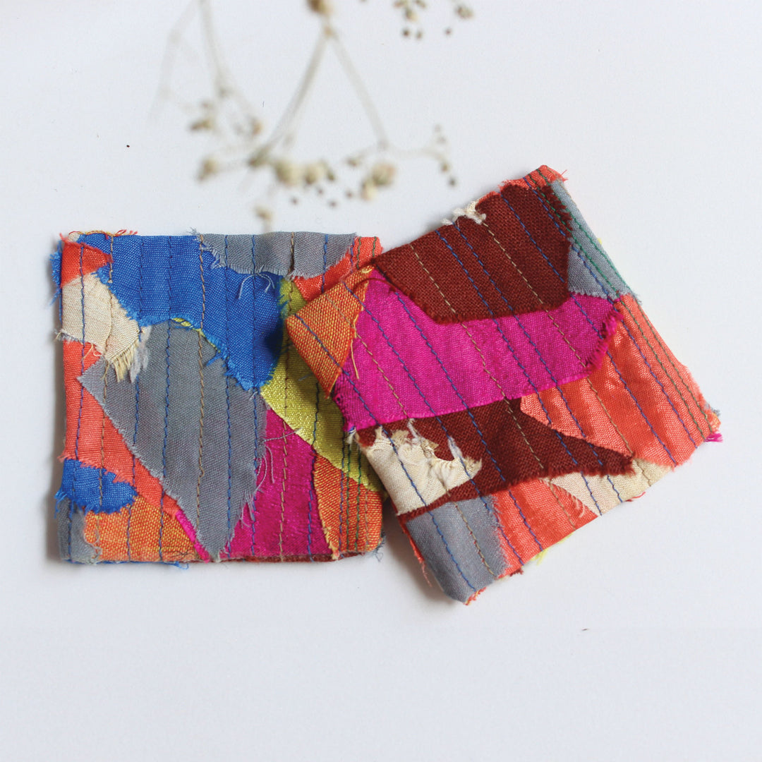 A set of four coasters made using post production scraps