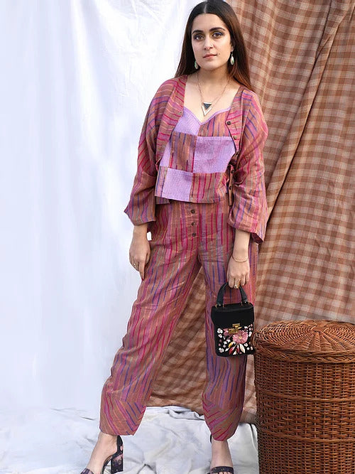 Striped raghi pants is made out of handloom cotton with coconut buttons and has a curved hem.
