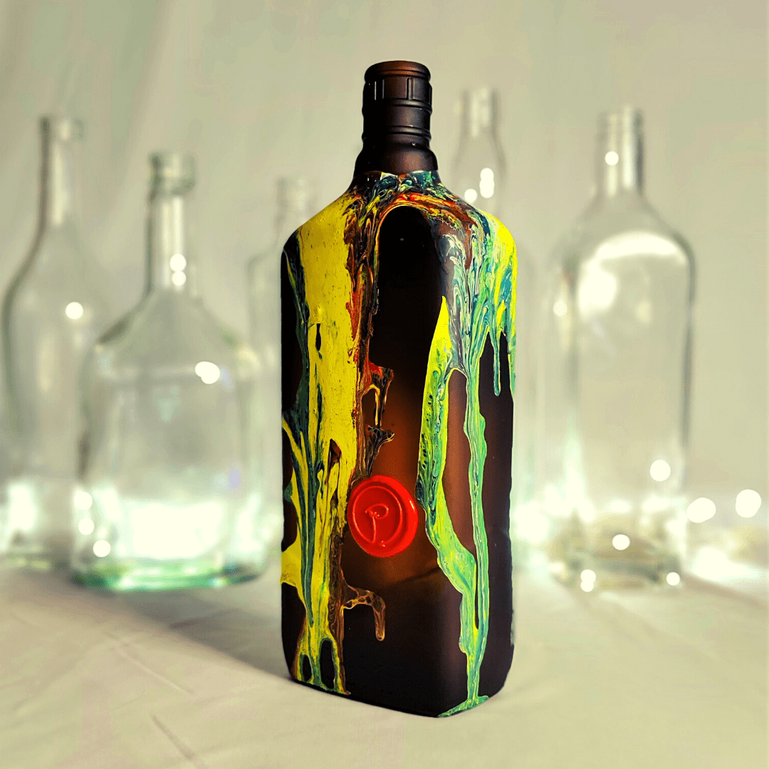 Handcrafterd upcycled glass bottle featuring bright colours and LED lights