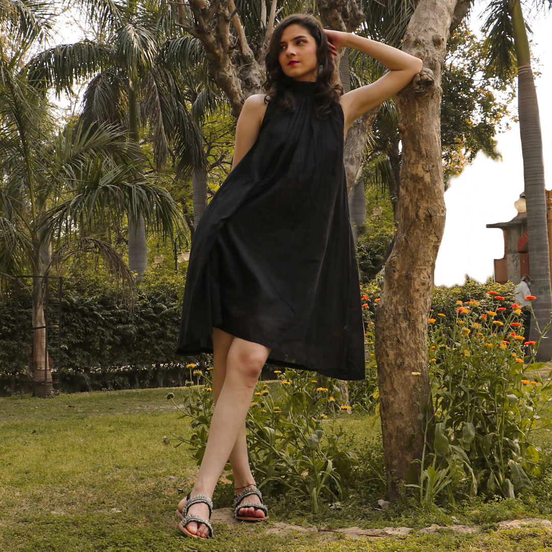 Black dress with bow tie closure. and ruching at the neckline