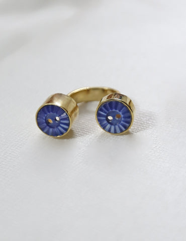 This gold plated open ring is made using upcycled shell buttons.