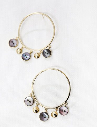 These earrings are made using upcycled mother of pearl shell buttons discarded by Christian Dior
