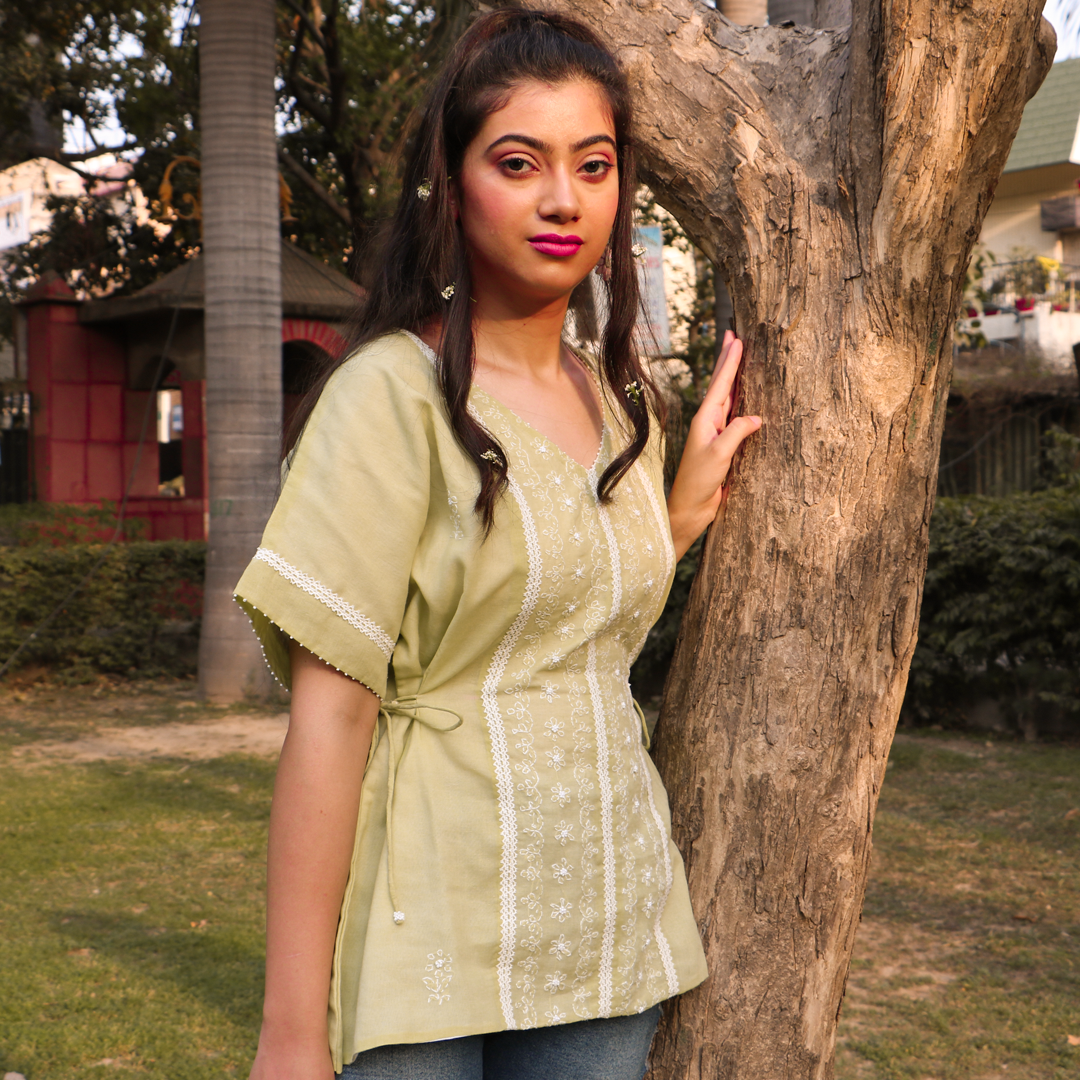 Chikankari peplum top, with hand embroidered beaded floral and lace details.