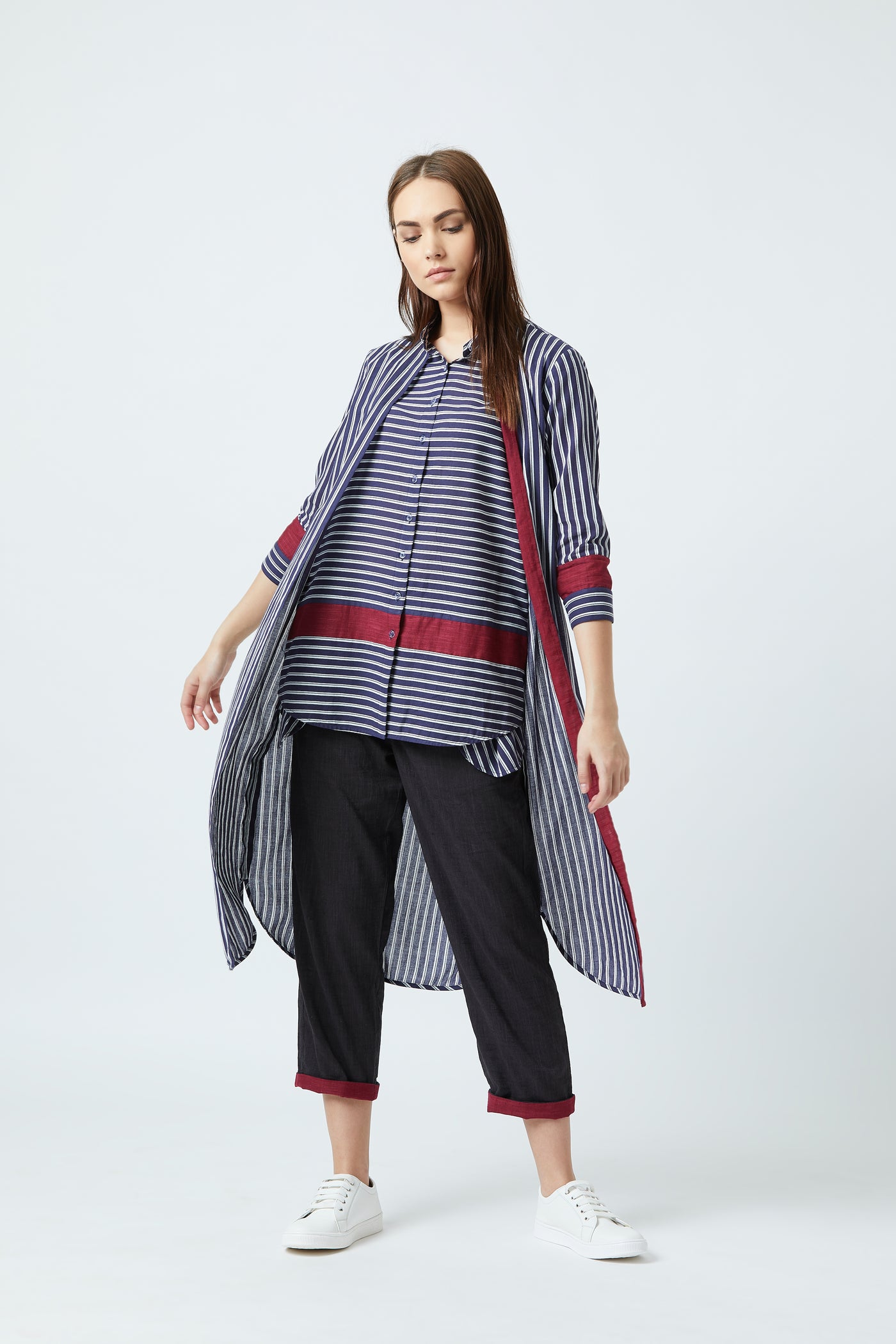 A blue tunic with white stripes and red detailing.