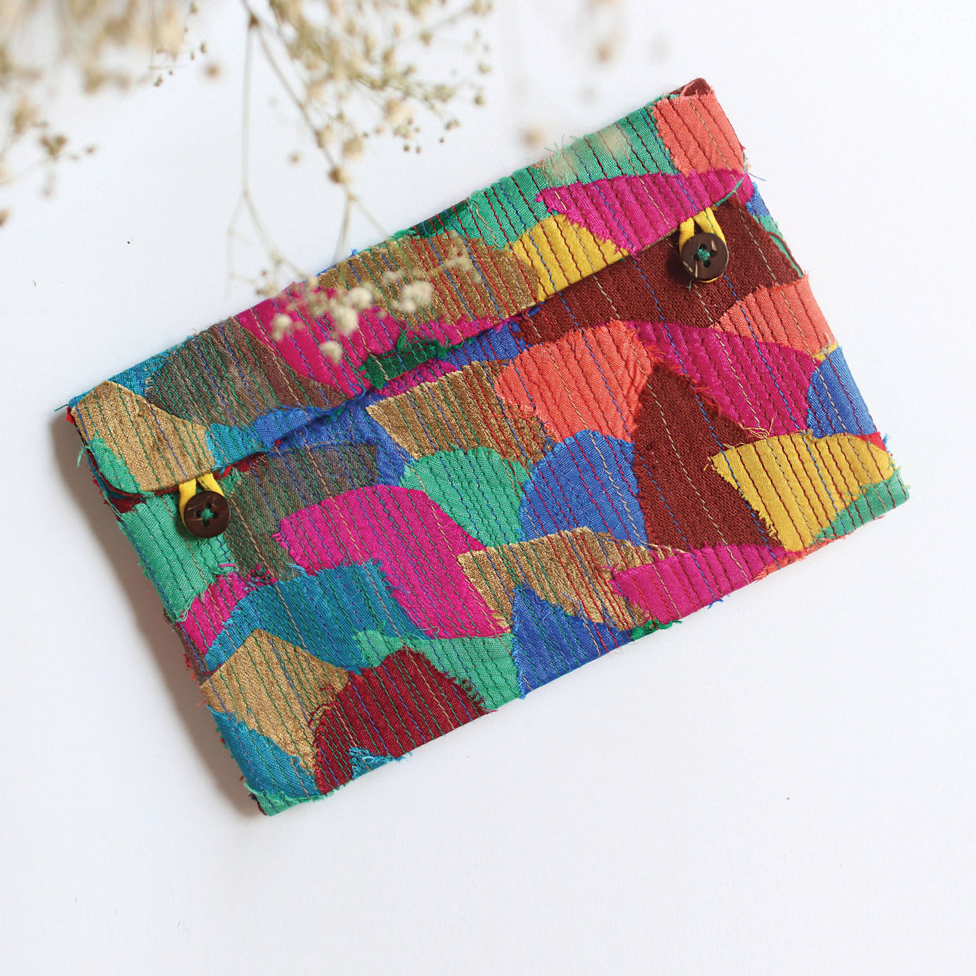colourful wallet made using post production scraps, featuring card slots and two pockets