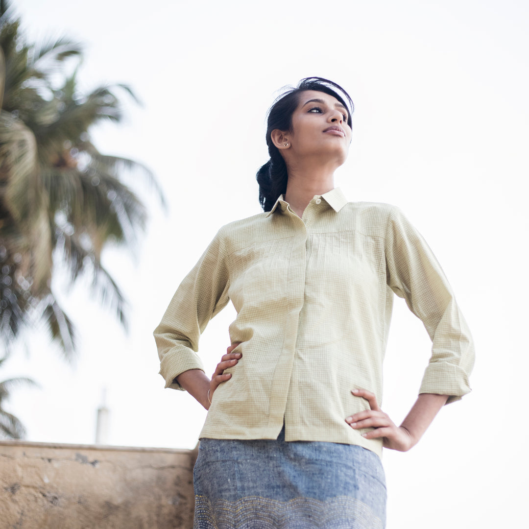 off white coloured collared shirt with buttons in the front