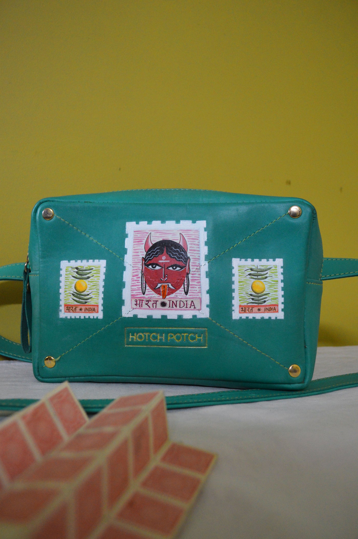 Green coloured bag with Bharat and India text and traditional woman's face