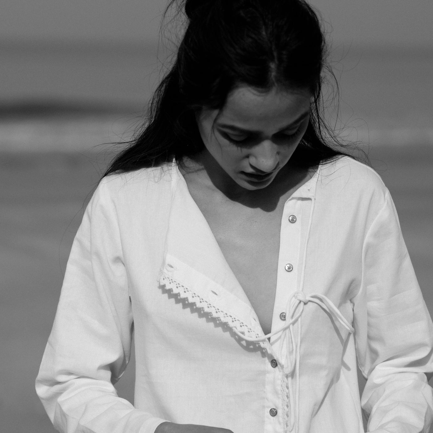 White mal full-sleeved shirt with a side placket with buttons and a top knot.