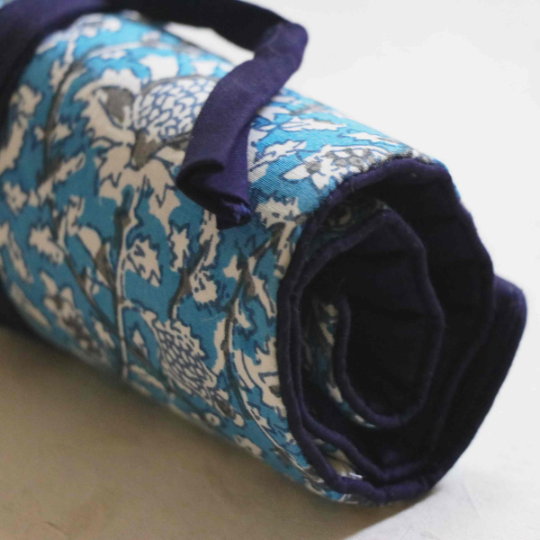 Blue Kalamkari Print Roll-up case tied using a dark blue cord that has a tassel attached to it.