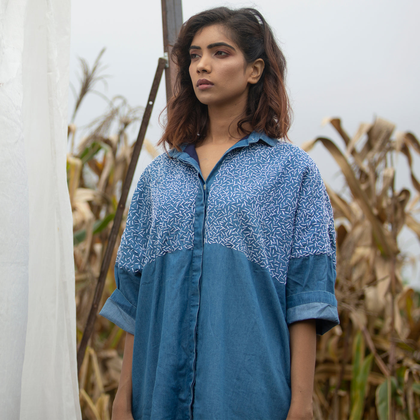 oversized denim dress featuring rice stitch hand embroidery in white