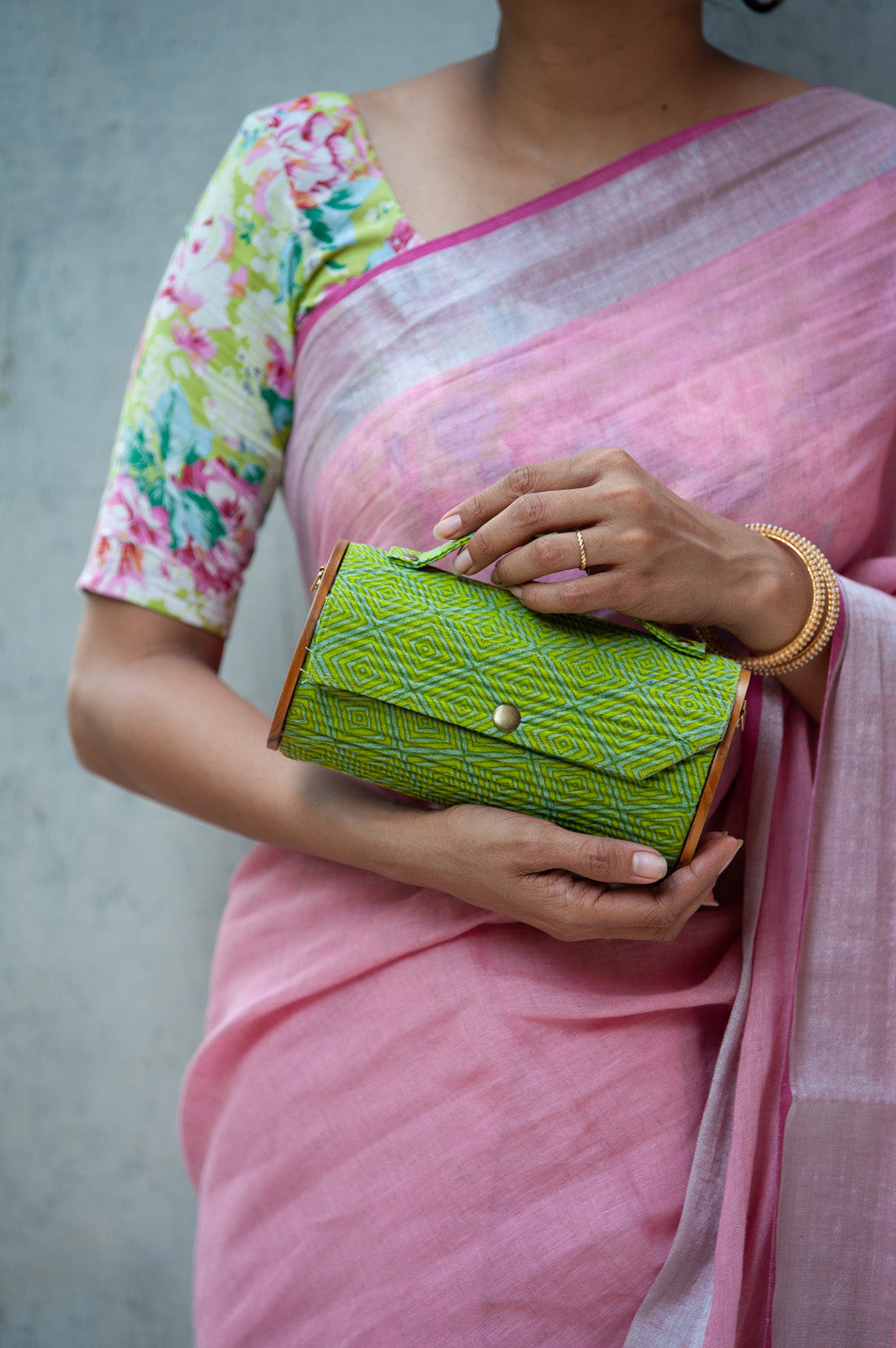 handcrafted round clutch comes with detachable sleeve, geometric Green pattern.