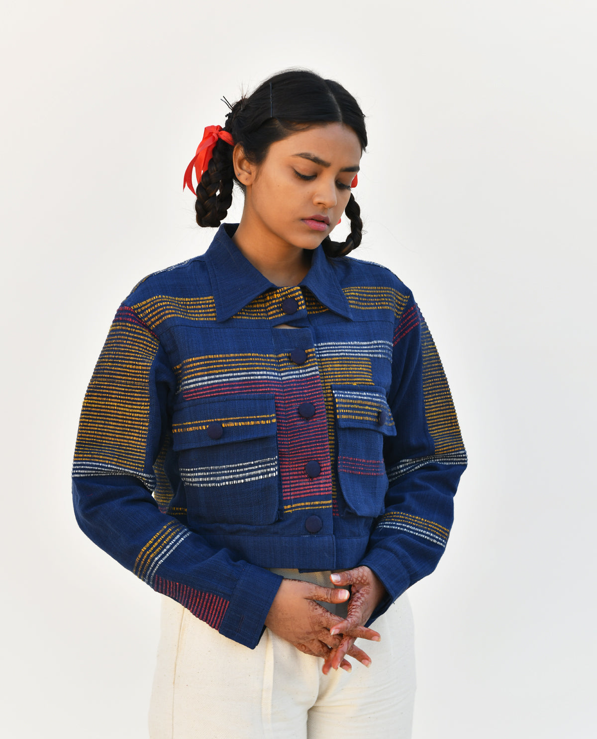 Jacket embodies the classic collar jacket silhouette and is handwoven in an extra weft technique.