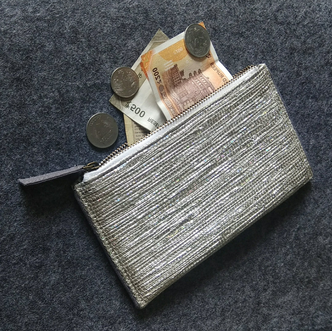 Pouch made from handwoven gift wrap paper and cotton zip pouch with grey lining.