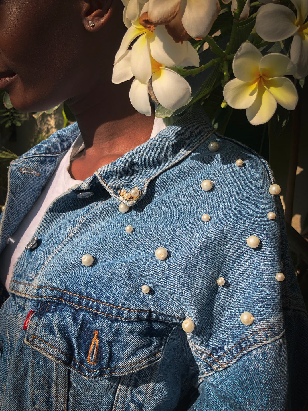 Oversized jacket decorated with pearl bead work with multi coloured parrots embellished behind