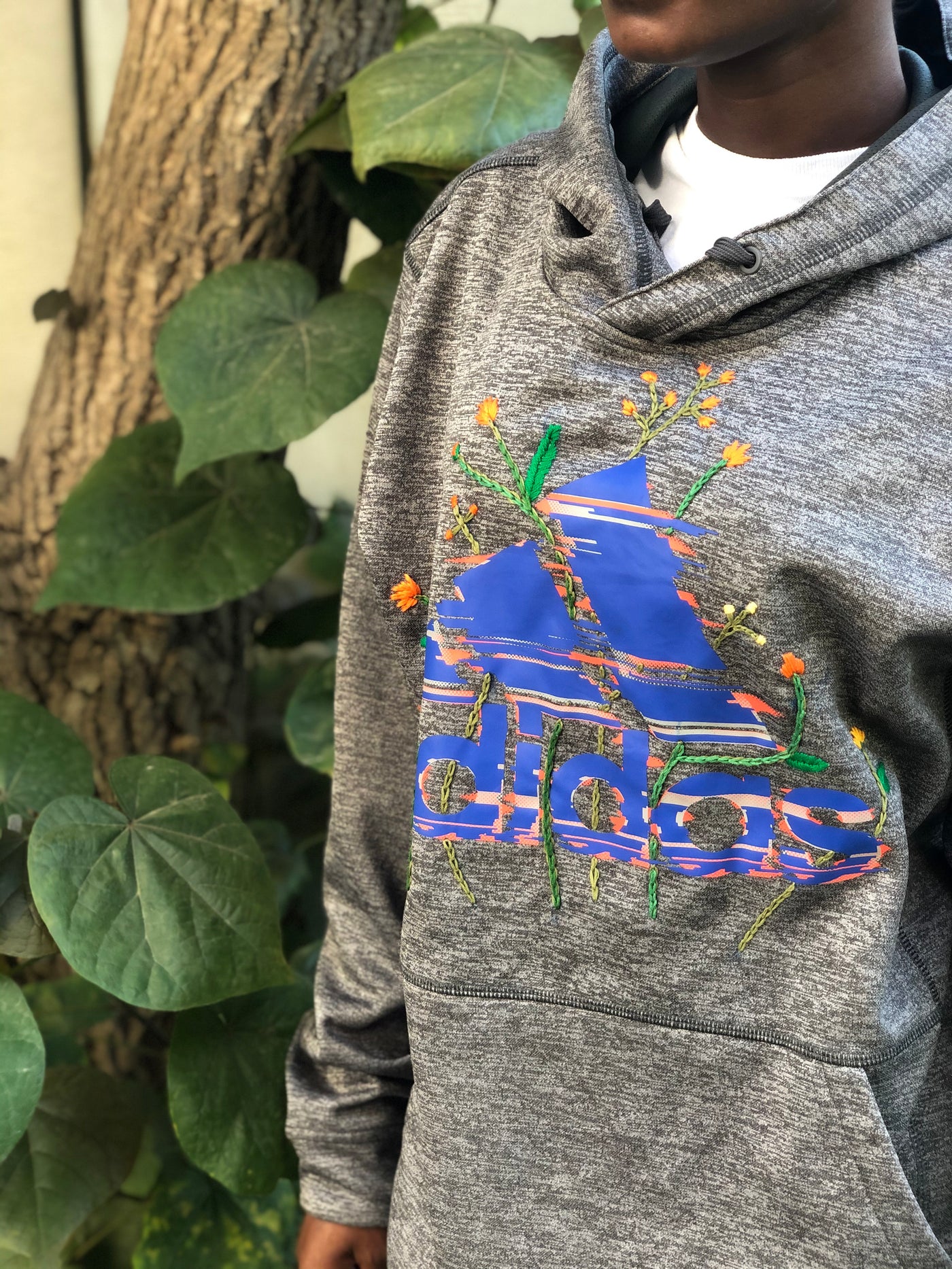 Hand embroidered upcycled Adidas hoodie with bright colours