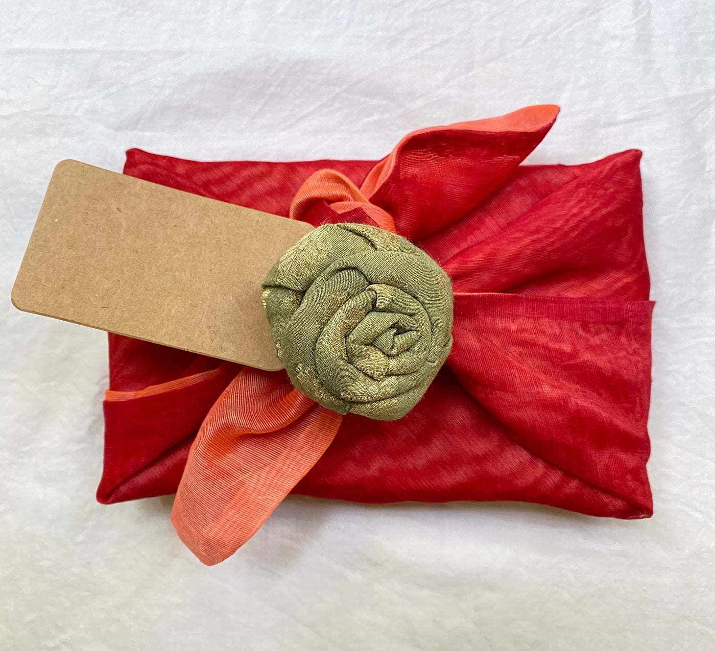 wrap comes along a cute brooch to garnish and a Kraft paper tag