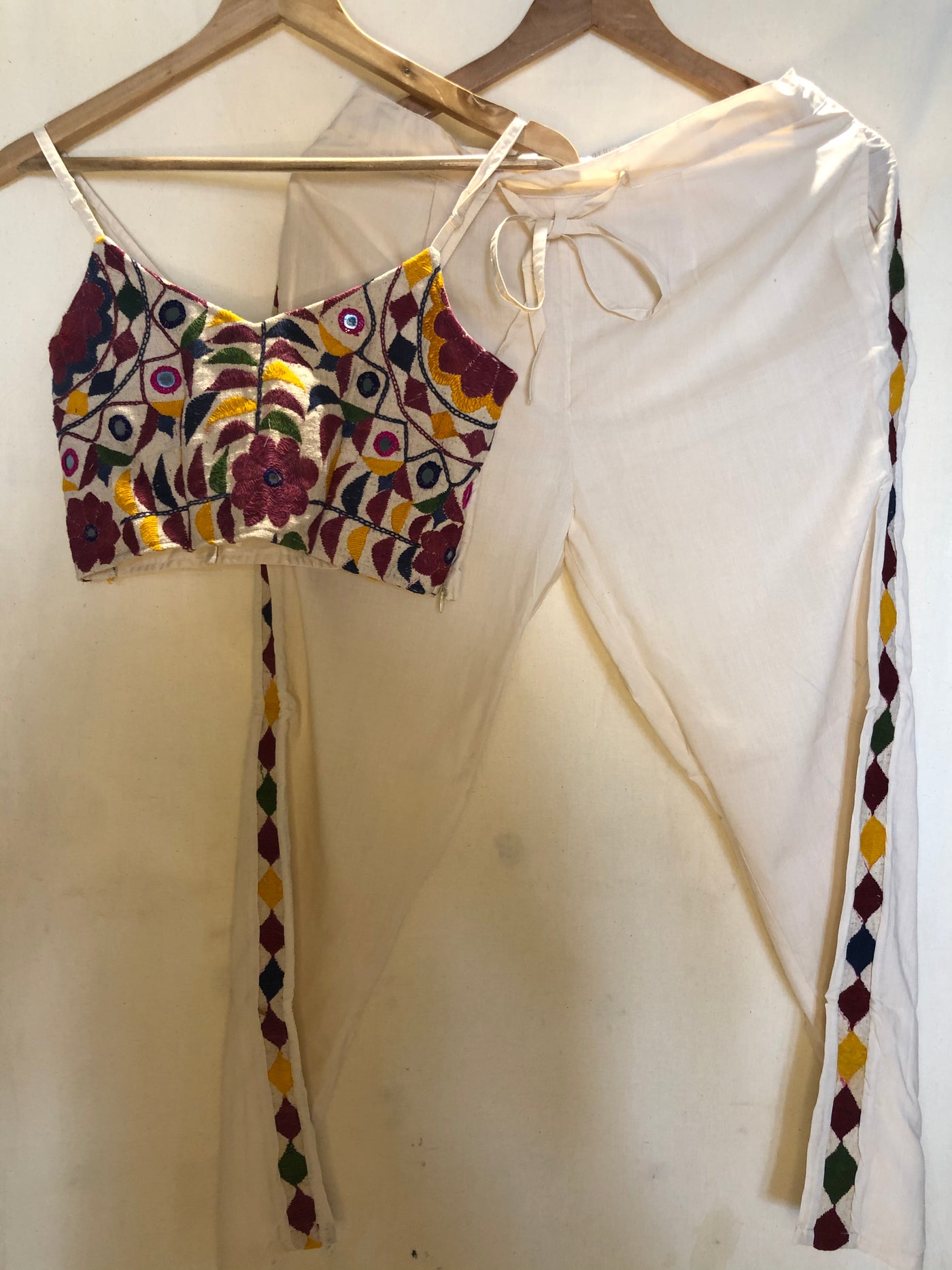 white co-ord set made from vintage rugs with adjustable straps and a side zipper