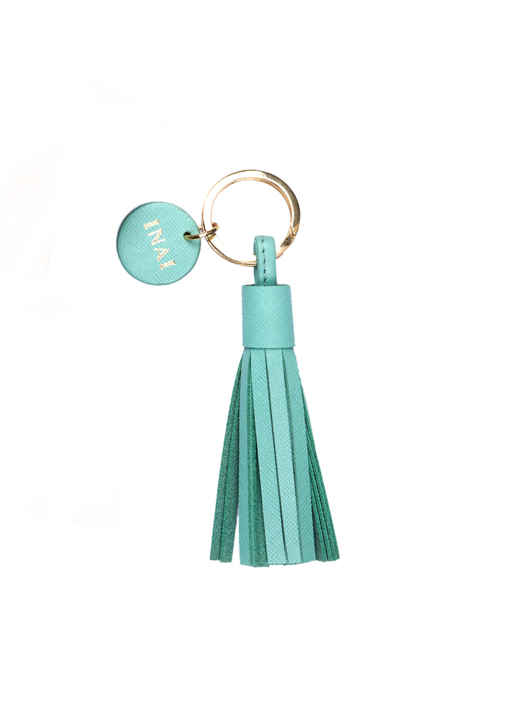 keychain with a round "INAI" label with a tassel