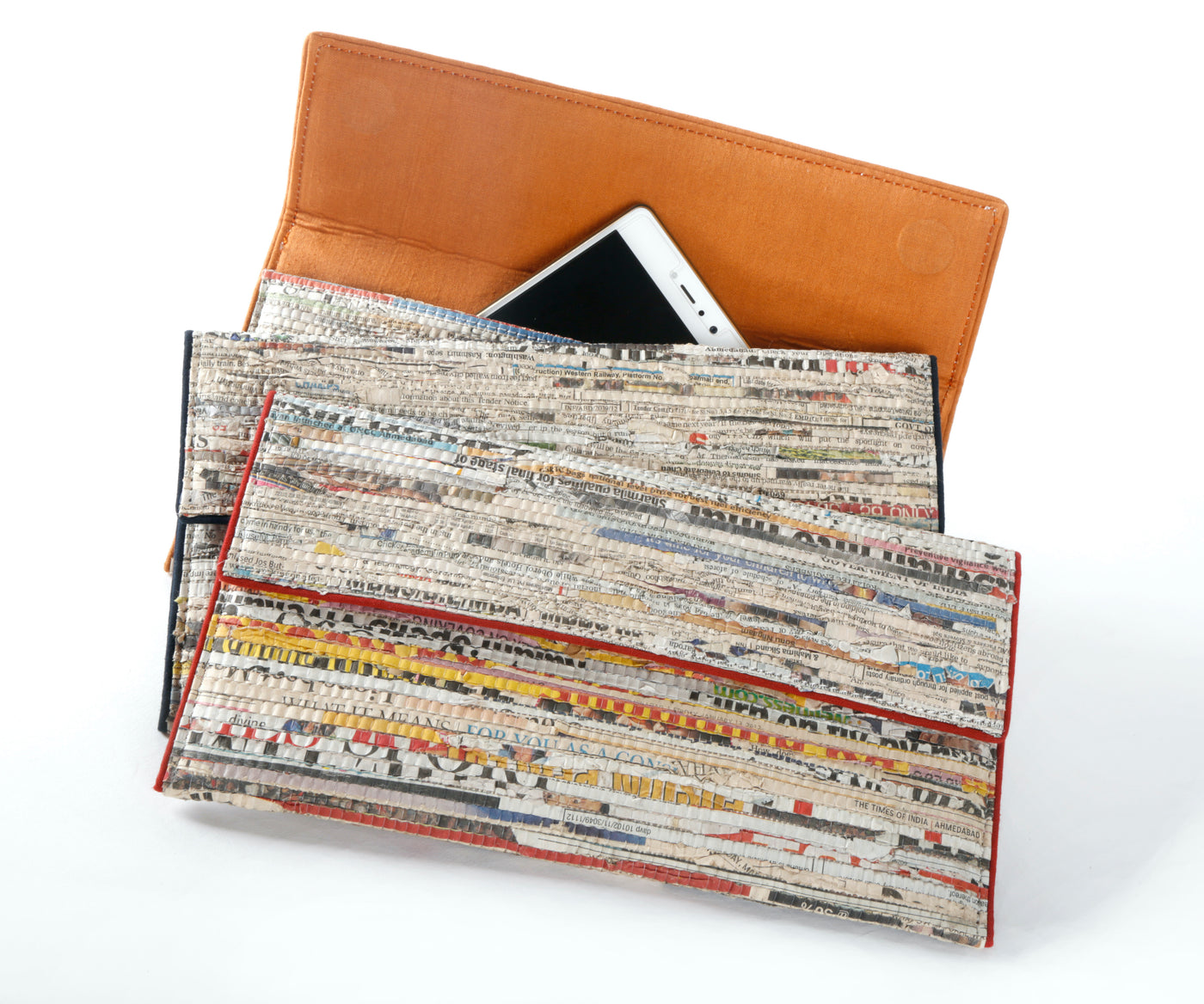 Handmade, functional wristlet made from cotton and newspaper strip comes with burnt maroon lining