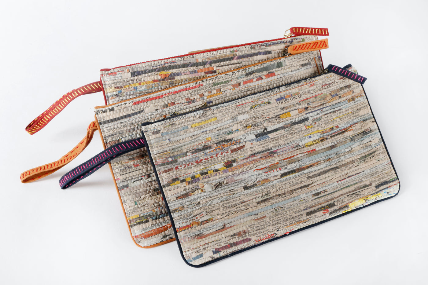 Handcrafted and handwoven with newspaper strips and cotton, newsprint pattern.