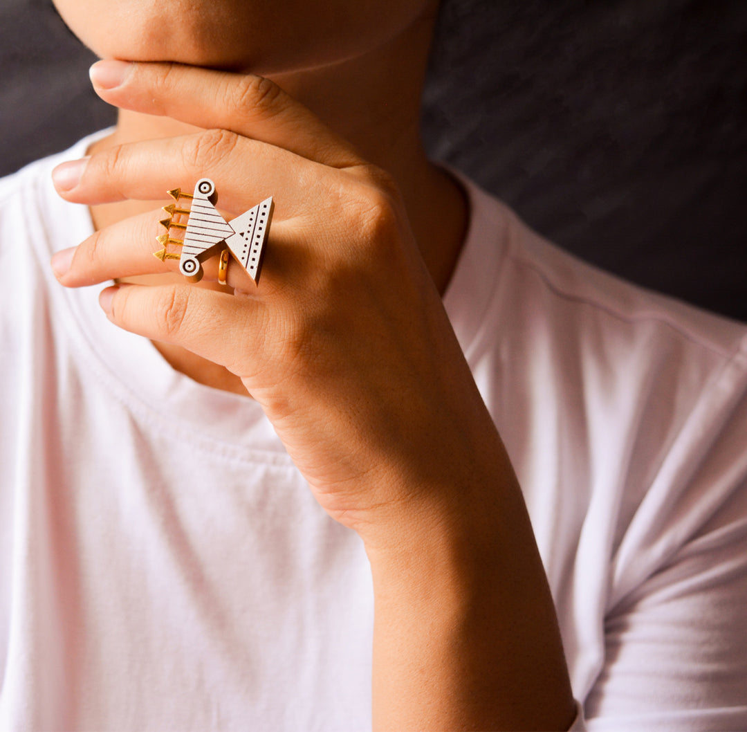 The gold ring is handcrafted using reclaimed teak wood and gold plated brass.