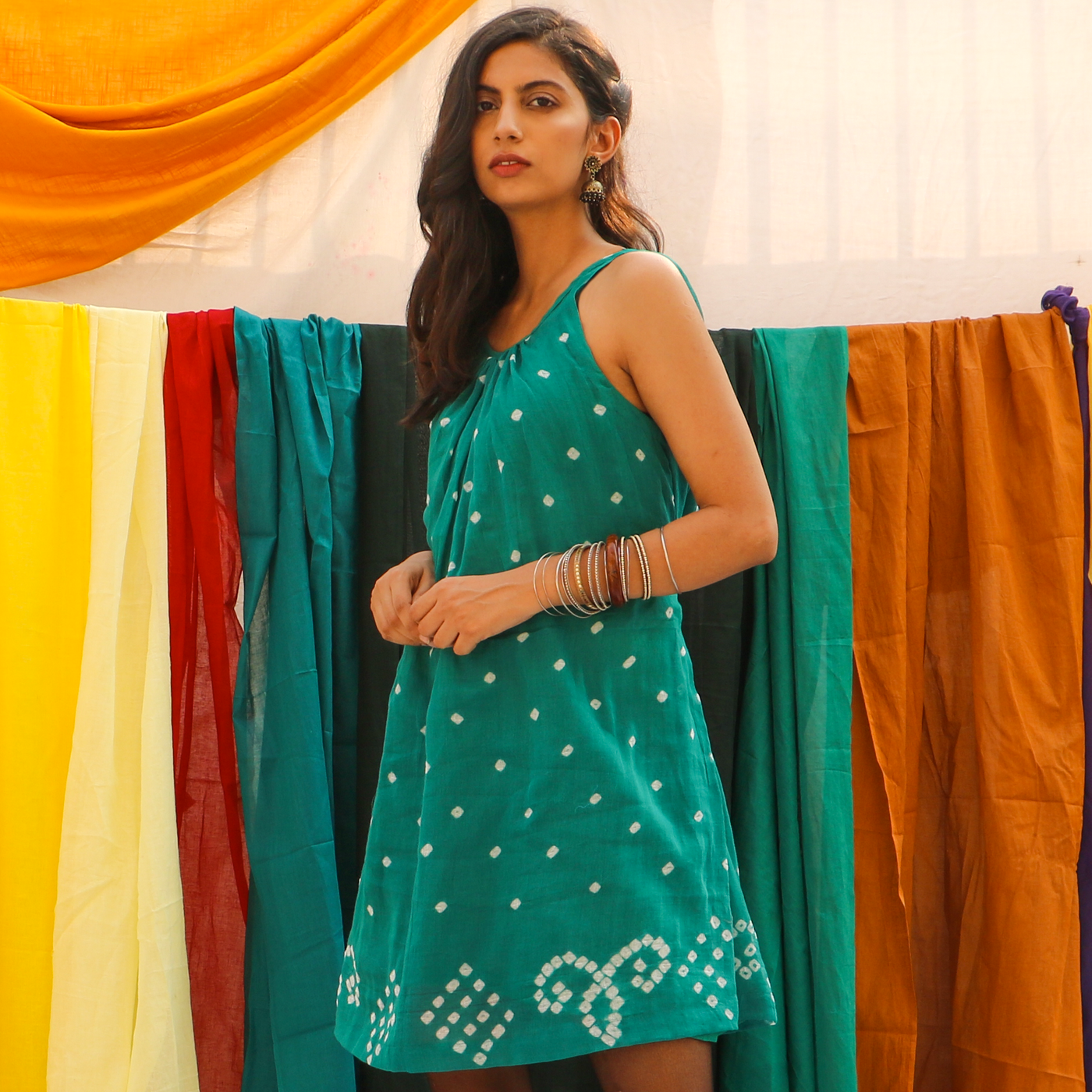 mini bandhani dress drawstrings at waist tie at the back comes with a slip dress to wear underneath.