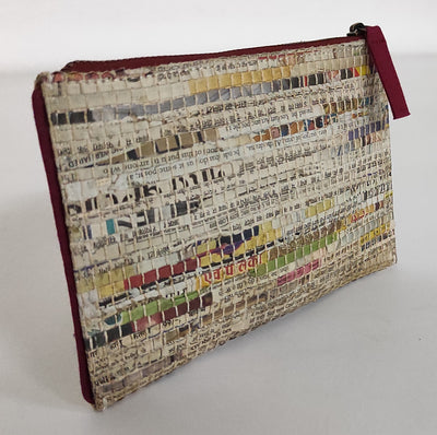 Bag is made and handwoven newspaper strips and cotton. Lining is made of recycled cotton fabric