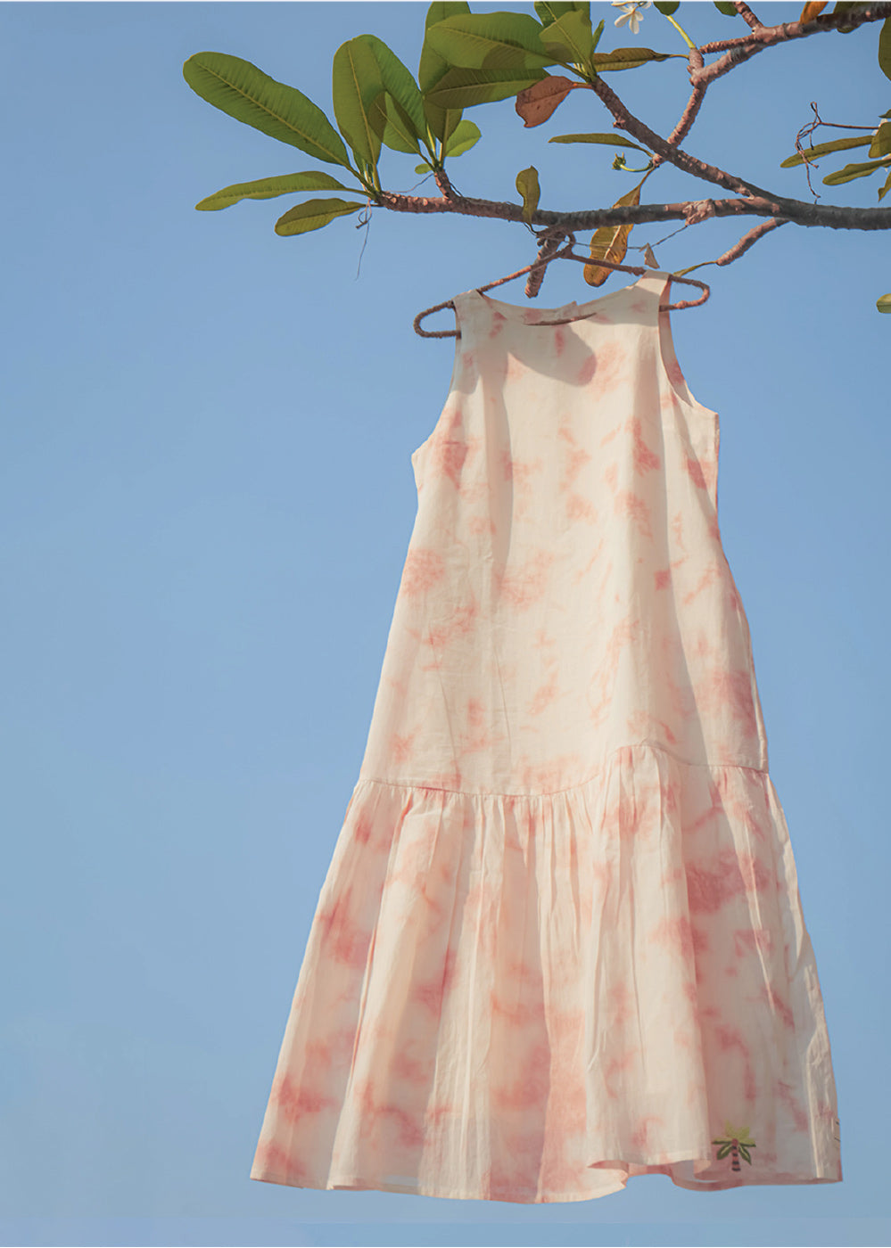 In shades of Pink, White and Beige is a comfortable fit dress with pockets,
