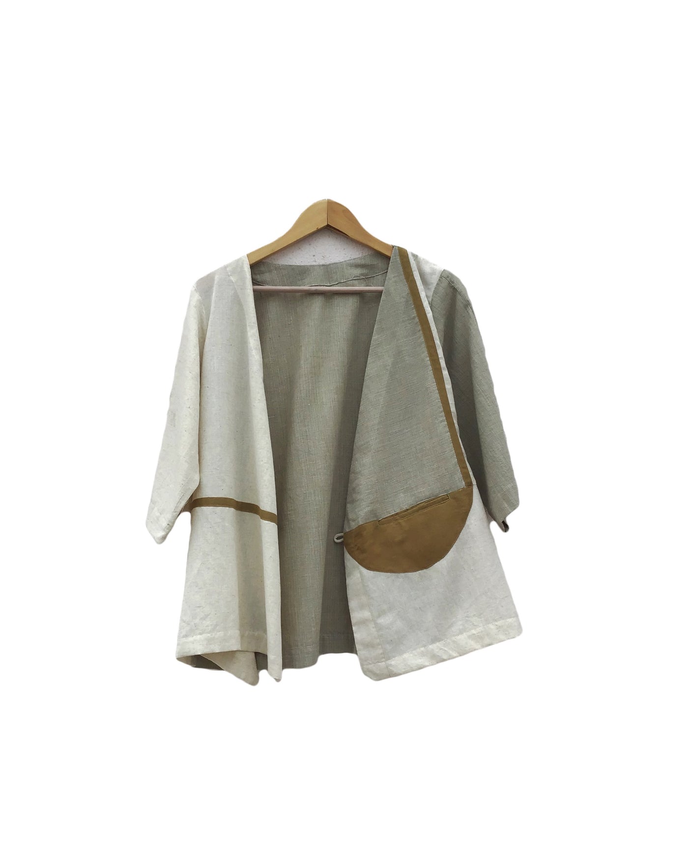 a kind wrap top enriched with patchwork in different neutral coloured patches