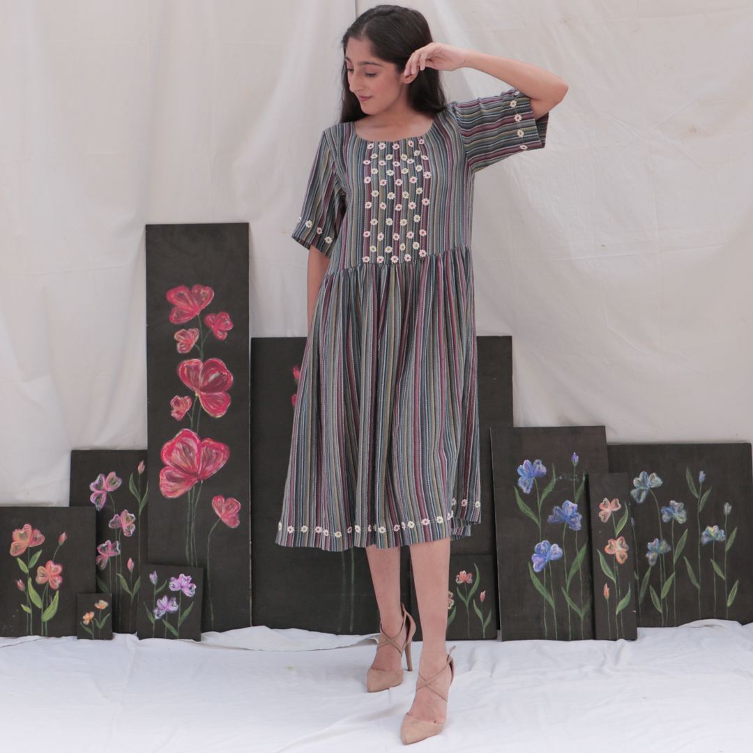 Multicolour striped midi dress with hand embroidered floral details.