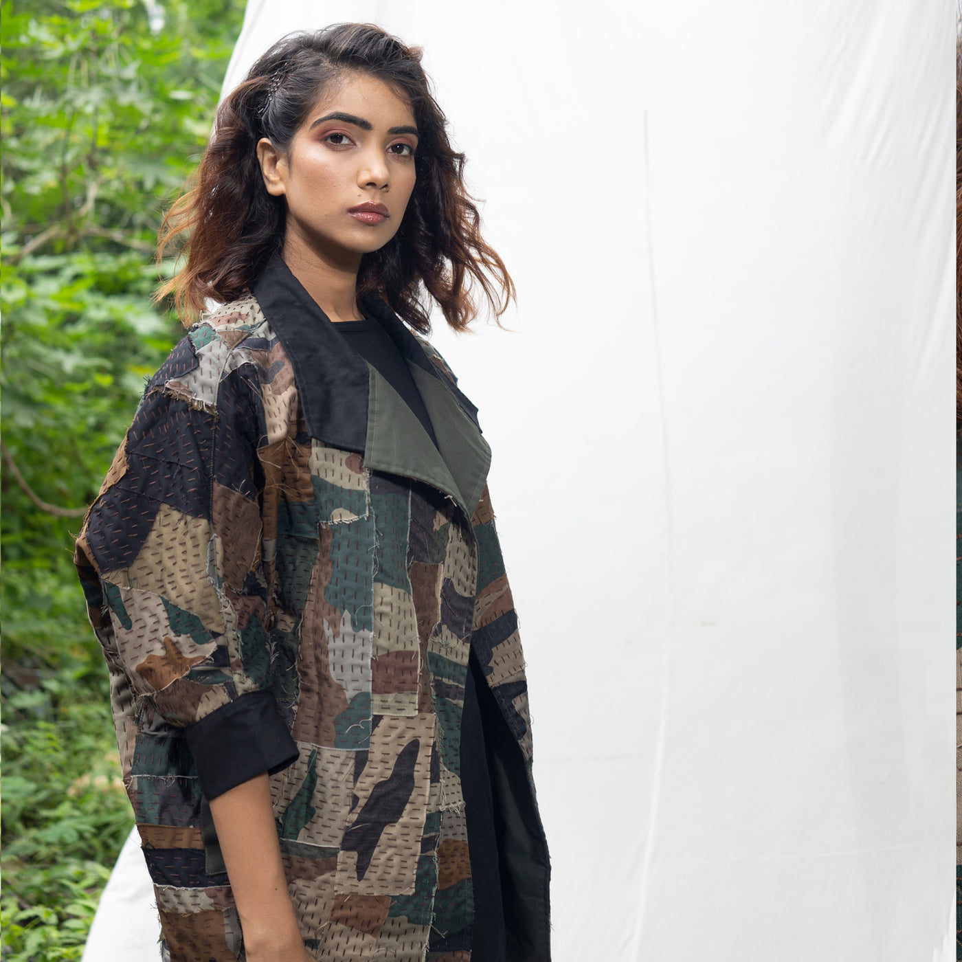 Green, black, and brown camo jacket, is made from camouflage scraps 